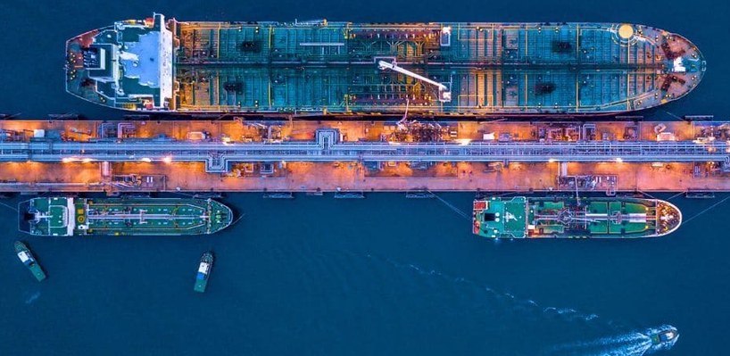 Aerial view of bunker barges alongside a tanker at a terminal jetty